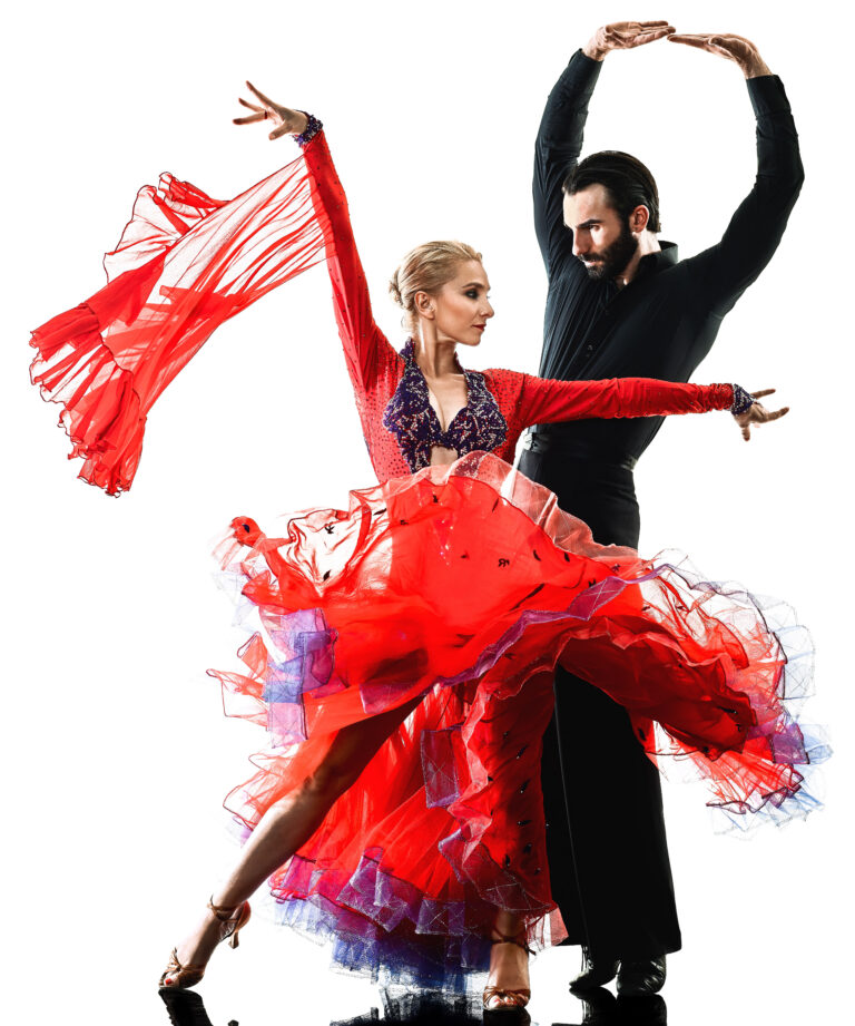 Ballroom dancers mid-performance, a woman in a flowing red gown arcing beside her partner in black.