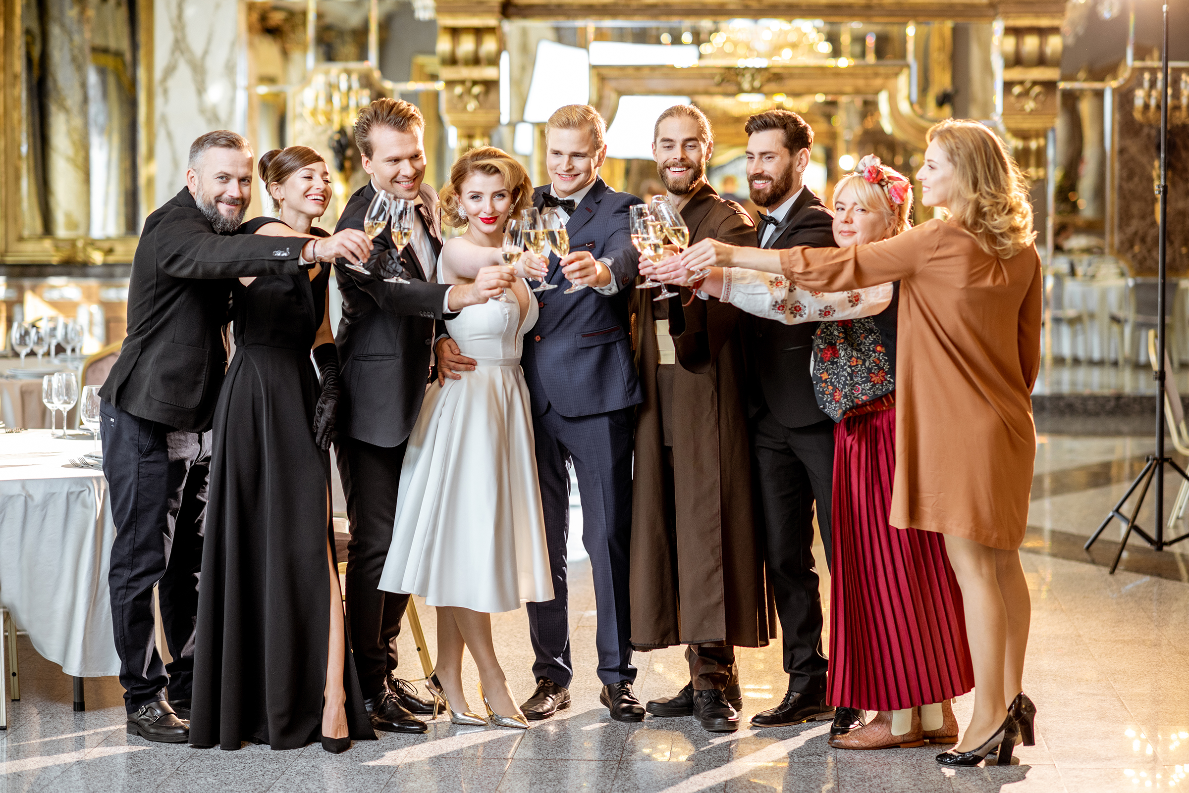 Well-dressed people toasting with champagne